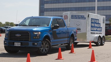 Lorraine Sommerfeld backs a trailer into a spot with a Ford F-150 and its autonomous back-up system.