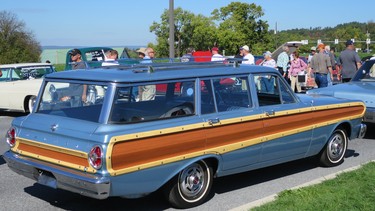 While early station wagons had real wooden bodies, later ones paid homage to the tradition with trim pieces, as on this 1965 Ford Falcon Country Squire. It was priced at US$14,750.