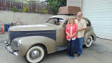 Christl and Craig Chapman with their 1940 Studebaker President sedan that is a restoration in progress.