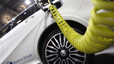 A Mercedes electric drive car is plugged for charging during the second press day of the 66th IAA auto show in Frankfurt, Germany.