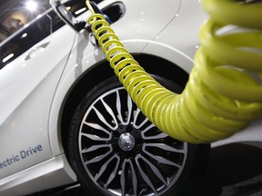 A Mercedes electric drive car is plugged for charging during the second press day of the 66th IAA auto show in Frankfurt, Germany.
