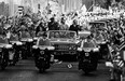 In 1976, thousands of Cuban people along the streets in Havana greet Prime Minister Pierre Elliott Trudeau as he accompanies Fidel Castro and then-president of Cuba, Osvaldo Dorticos