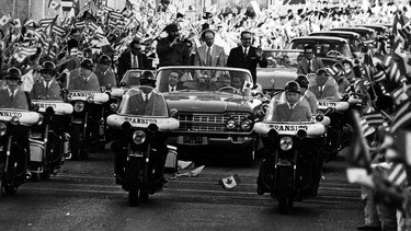 In 1976, thousands of Cuban people along the streets in Havana greet Prime Minister Pierre Elliott Trudeau as he accompanies Fidel Castro and then-president of Cuba, Osvaldo Dorticos