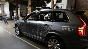 An Uber driverless car is displayed in a garage in San Francisco. The ride-hailing company is refusing to obey demands by the state's Department of Motor Vehicles that it stop picking up San Francisco passengers in specially equipped Volvo SUVs. Hours after Uber launched the self-driving service on Dec. 14, the DMV warned it was illegal because the cars did not have a special permit.