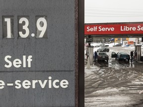 Motorists fuel up their cars at a gas station in Ottawa on Tuesday January 3, 2017.
