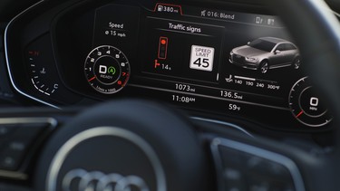 The dashboard of an Audi A4 is seen during a demonstration of Audi's vehicle-to-infrastructure technology in Las Vegas. The technology allows vehicles to "read" red lights ahead and tell the driver how long it'll be before the signal turns green. For the driver, the system puts a traffic signal icon on the dashboard telling how many seconds the light will remain red.