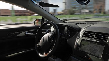 An autonomous car controlled by a Nvidia DRIVE PX 2 AI car computing platform drives along a course during CES International in Las Vegas.
