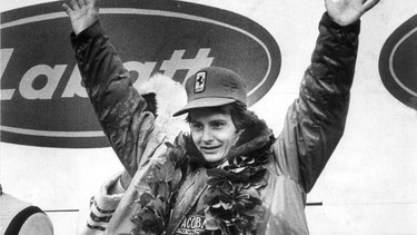 Gilles Villeneuve waves from the podium following his 1978 victory in Montreal.