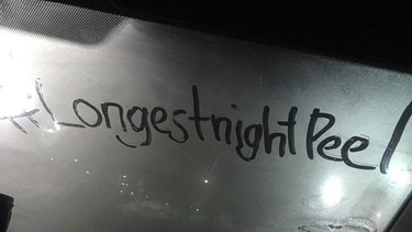 Someone outlined the hashtag for the United Way's Longest Night campaign on the inside of a windshield.