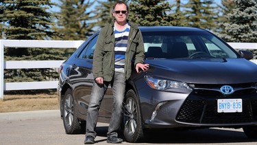 Reader review driver Richard Phillips stands with the 2017 Toyota Camry SE Hybrid he test drove.