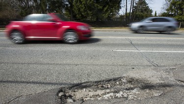 A typical Toronto street, where dodging potholes is almost a sport.