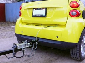 A custom hitch allows even a Smart ForTwo to tow light loads