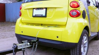 A custom hitch allows even a Smart ForTwo to tow light loads