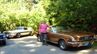 Carol LeGrand - aka Mustang Sally - with some of the pony cars lovingly restored with her husband Dave.