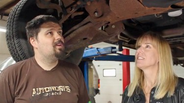 Chris Muir, left, and Lorraine Sommerfeld explain what mechanics look for in vehicle inspections.