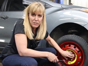 Lorraine Sommerfeld shows how to change a tire.