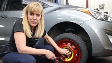 Lorraine Sommerfeld shows how to change a tire.
