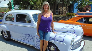 Kelli MacLanders is a regular at collector car shows in British Columbia and west coast states driving her mauve 1947 Ford with purple flames.