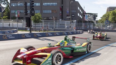 Lucas Di Grassi of Brazil, with ABT Schaeffler, drives through the first turn on his way to winning the driver's championship at Sunday's Montreal Formula ePrix.