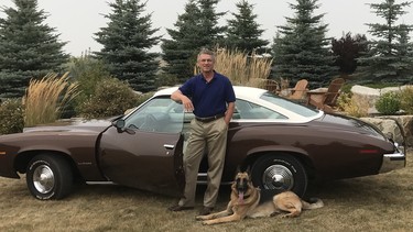 Gary Paukert and his dog Bridger pose with the 1973 Pontiac LeMans that's like a time machine for the Calgarian.