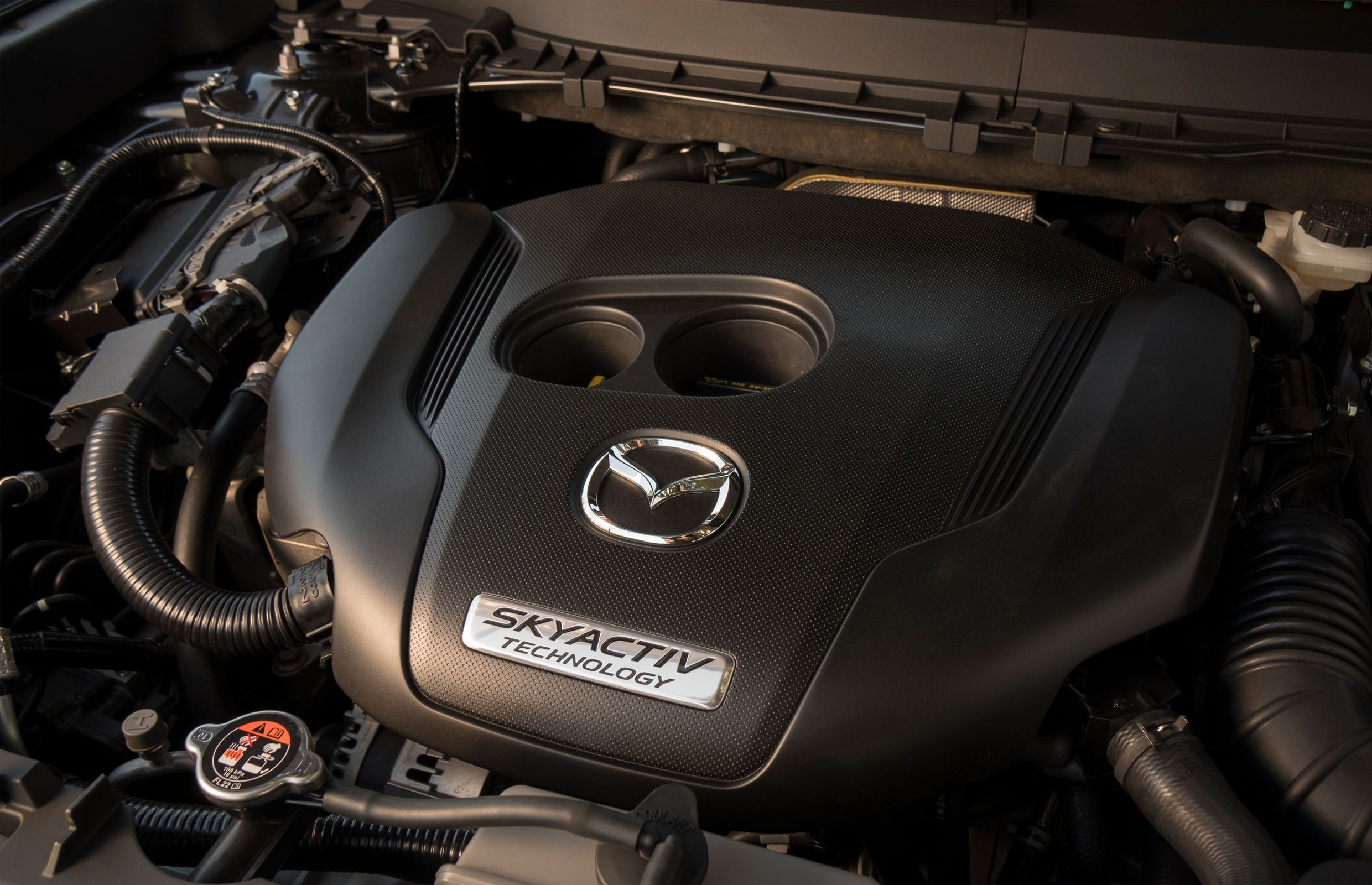 Mazda planning to unveil compressionignition gas engine by 2019 Driving