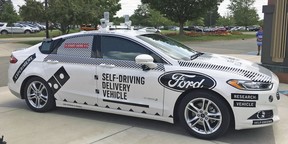 This Aug. 24, photo shows the specially designed delivery car that Ford Motor Co. and Dominoís Pizza will use to test self-driving pizza deliveries, at Dominoís headquarters in Ann Arbor, Mich. Ford and Dominoís are teaming up to test how consumers react if a driverless car delivers their pizzas. The car, which can drive itself but will have a backup driver, lets customers tap in a code and retrieve their pizza from a warming space in the back seat.