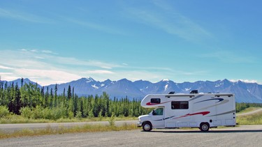 The family’s CanaDream Midi Motorhome pictured on the Alaska Highway with mountains of the St. Elias Range in the distance.