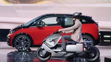 BMW's i3 and electric scooter on stage at the 2017 Frankfurt Motor Show.