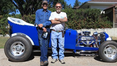 The man who owned the car that prompted the tribute car a half-century later, John Cassidy, left, checks out the tribute car built by Wesley McRadu, right.