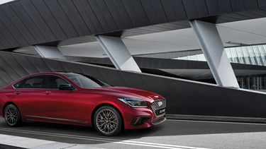 2018_Genesis_G80_Sport_TurbineRed_Exterior_Overpass_4c_m