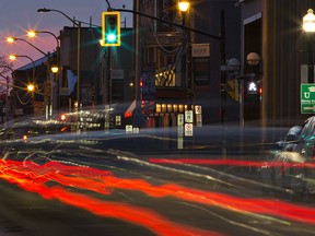 Tail lights of vehicles are streaked as they travel along Dalhousie Street in Brantford, Ontario.
