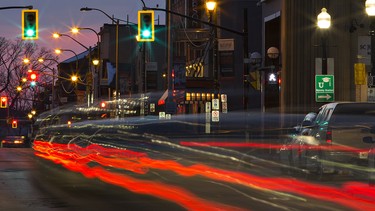 Tail lights of vehicles are streaked as they travel along Dalhousie Street in Brantford, Ontario.