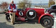 Dick Tilden with his 1924 Bentley 3 Litre Speed that he drove from Portland, Oregon in rainy weather  with the convertible top down.