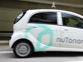 A nuTonomy autonomous vehicle is driven during its test in Singapore. Lyft and its Boston-based partner nuTonomy, which builds autonomous software, announced that a pilot project has begun sending self-driving cars to pick up commuters in Boston's Seaport District, a burgeoning technology hub.
