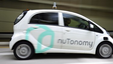 A nuTonomy autonomous vehicle is driven during its test in Singapore. Lyft and its Boston-based partner nuTonomy, which builds autonomous software, announced that a pilot project has begun sending self-driving cars to pick up commuters in Boston's Seaport District, a burgeoning technology hub.