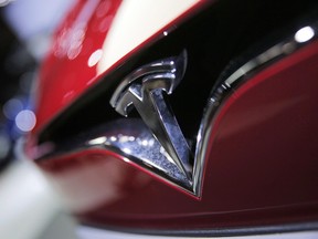 The logo of the Tesla Model S on display at the Paris Auto Show in Paris on Sept. 30, 2016.