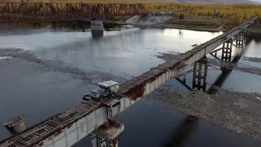 A Ford Bronco crossing the Vitim River in Siberia