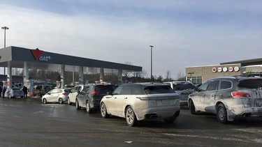 A lineup of cars waiting for gas at the Mallorytown (East) ONroute on January 1, 2018.