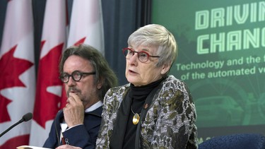 Senate Committee on Transport and Communications deputy chair Senator Dennis Dawson (left) listens as deputy chair Senator Patricia Bovey responds to a questions during a news conference regarding connected and automated vehicles in Ottawa, Monday, January 29, 2018.