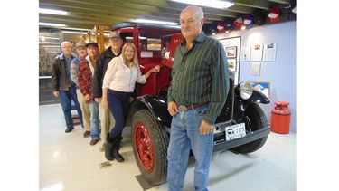 British Columbia Vintage Truck Museum President Chenn Bergen and some of the volunteers who have donated 36,000 hours to restore the trucks and operate the museum.