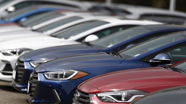 Hyundai Sonatas sit on a dealership lot.