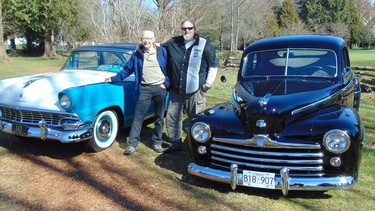 Don and Steve Holloway with their beautifully restored black 1947 Ford businessman’s coupe and very rare 1956 Ford Fairlane Crown Victoria Skyliner with a see-through plexiglass front roof panel.