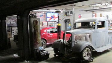 A nighttime peek into Dan Brochu's garage reveals a 1934 Chevy hot rod that he's been working on for almost two decades and a 1969 Mustang Mach I.