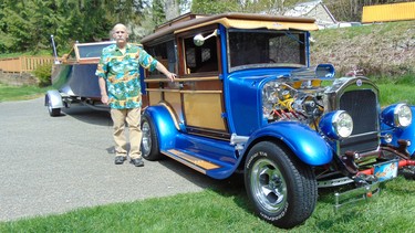 Bill Milligan with the woody hot rod he built and his restored 1961 Chris Craft runabout that has never been put in the water.