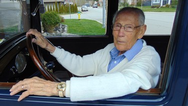 Bill Cameron behind the wheel of an Essex similar to the one he rode in with his parents and five siblings on a move from Manitoba to Vancouver during the Depression.