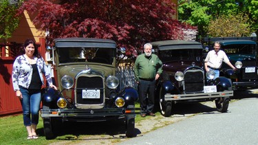 Sue, Frank and Farrell White with their fleet of Ford Model A vehicles which are driven year-round.