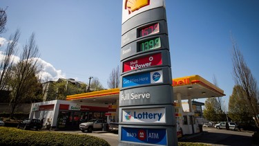 The price of a litre of gasoline of $1.579, an all-time high for the city, is displayed on a sign as motorists fuel up at a Shell gas station in Vancouver, B.C., on Sunday April 22, 2018.