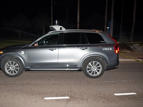 This image provided by the Tempe Police Department shows an Uber SUV after hitting a woman on March 18, 2018 in Tempe, Ariz.