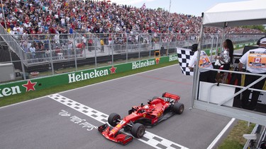 Ferrari's Sebastian Vettel of Germany crosses the finish line to win the Canadian Grand Prix Sunday, June 10, 2018 in Montreal.