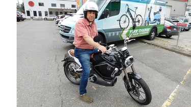 Motorino owner Steve Miloshev aboard the Super Soco TC, an all-electric motorcycle his Vancouver store has exclusive Canadian rights to.